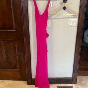 Hot pink jumpsuit with cross cross back and pockets